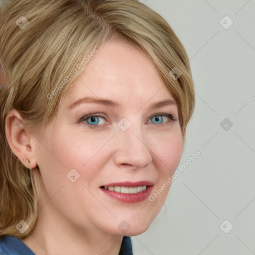 Joyful white young-adult female with medium  brown hair and blue eyes