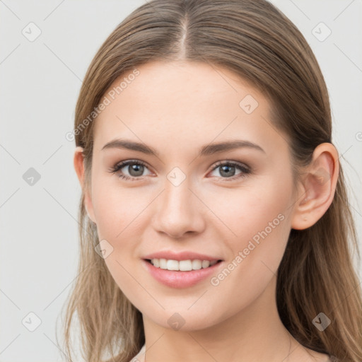 Joyful white young-adult female with long  brown hair and grey eyes