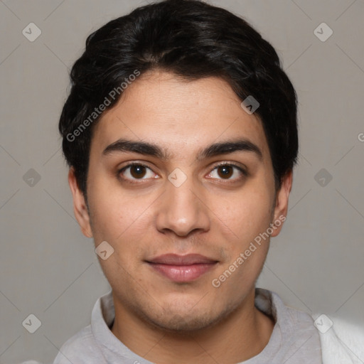 Joyful white young-adult male with short  black hair and brown eyes