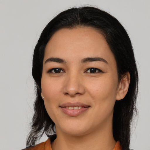 Joyful latino young-adult female with medium  black hair and brown eyes