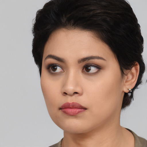 Neutral asian young-adult female with medium  black hair and brown eyes