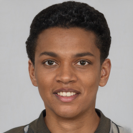 Joyful black young-adult male with short  black hair and brown eyes