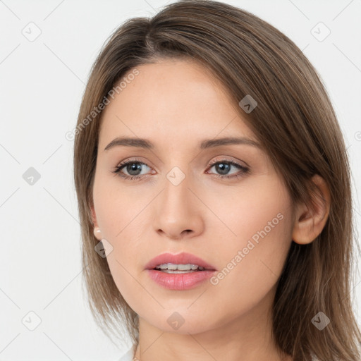 Neutral white young-adult female with long  brown hair and brown eyes