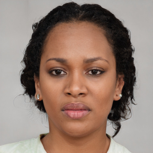 Neutral black young-adult female with medium  black hair and brown eyes