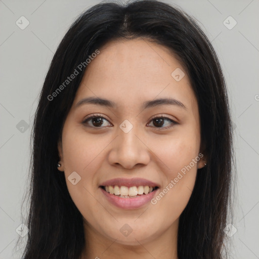 Joyful latino young-adult female with long  brown hair and brown eyes