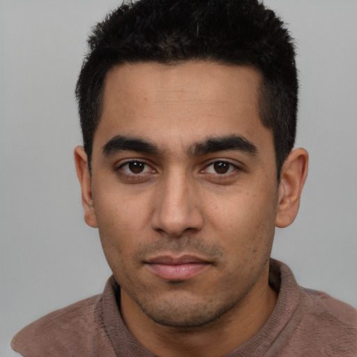 Neutral latino young-adult male with short  black hair and brown eyes