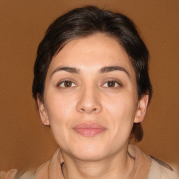 Joyful white adult female with medium  brown hair and brown eyes