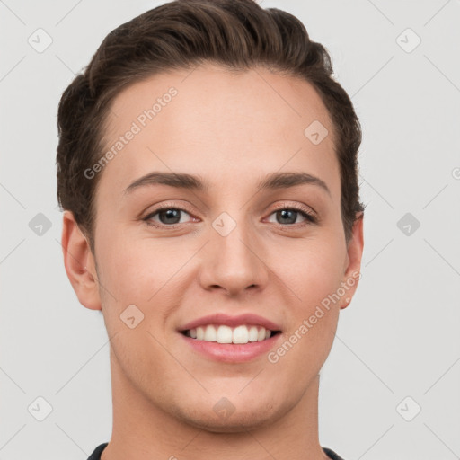 Joyful white young-adult female with short  brown hair and grey eyes