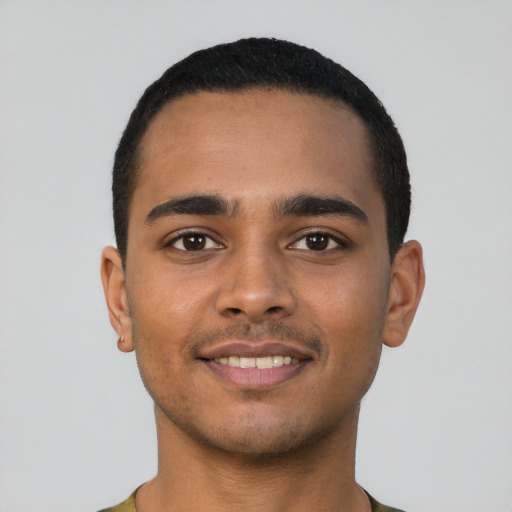 Joyful latino young-adult male with short  black hair and brown eyes