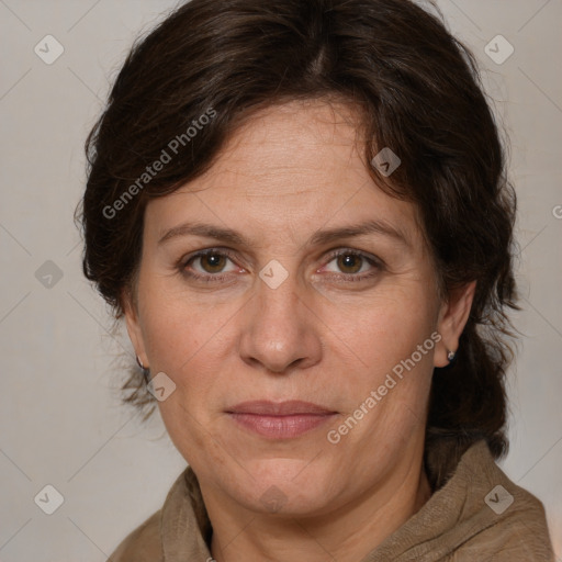 Joyful white adult female with medium  brown hair and grey eyes