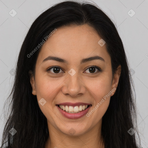 Joyful latino young-adult female with long  brown hair and brown eyes