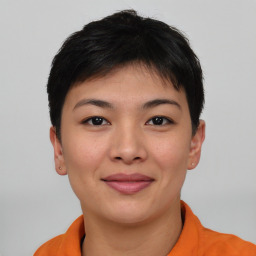 Joyful asian young-adult female with short  black hair and brown eyes