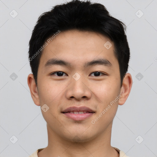 Joyful asian young-adult male with short  brown hair and brown eyes