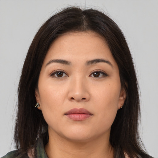 Neutral asian young-adult female with medium  brown hair and brown eyes
