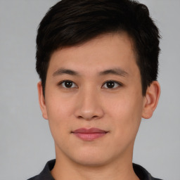 Neutral asian young-adult male with short  brown hair and brown eyes