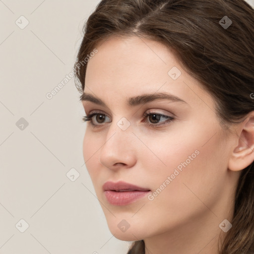 Neutral white young-adult female with long  brown hair and brown eyes