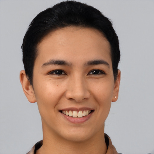 Joyful asian young-adult female with short  black hair and brown eyes