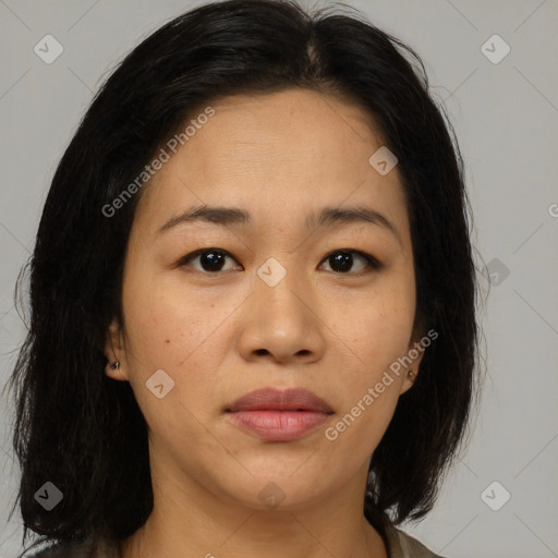 Joyful asian young-adult female with medium  brown hair and brown eyes