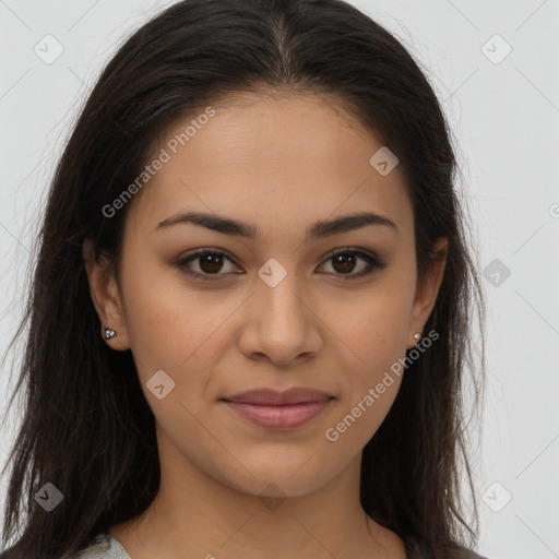 Joyful latino young-adult female with long  brown hair and brown eyes