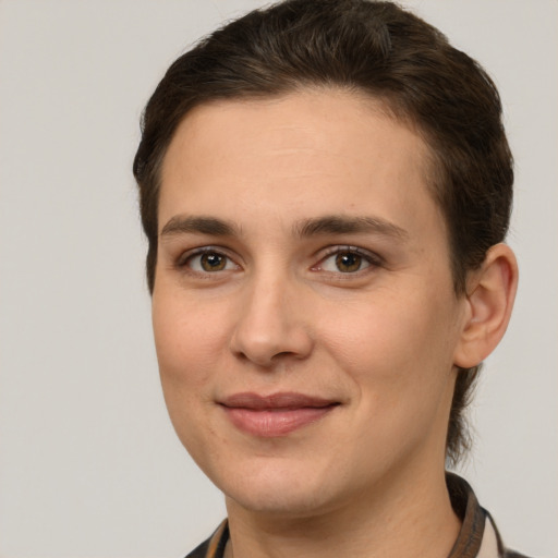 Joyful white young-adult female with short  brown hair and grey eyes