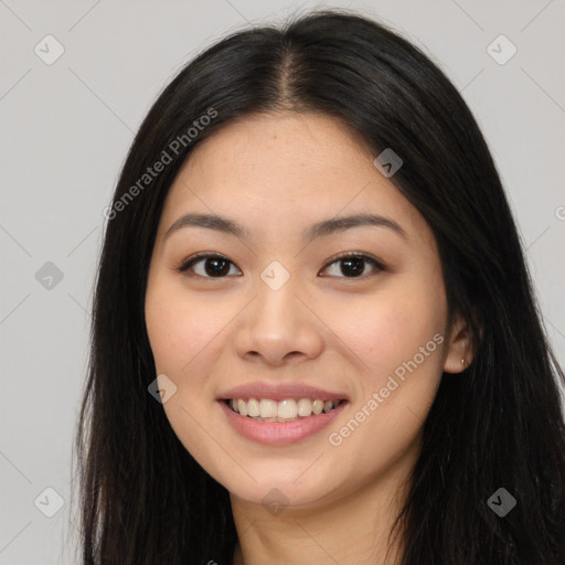 Joyful asian young-adult female with long  black hair and brown eyes