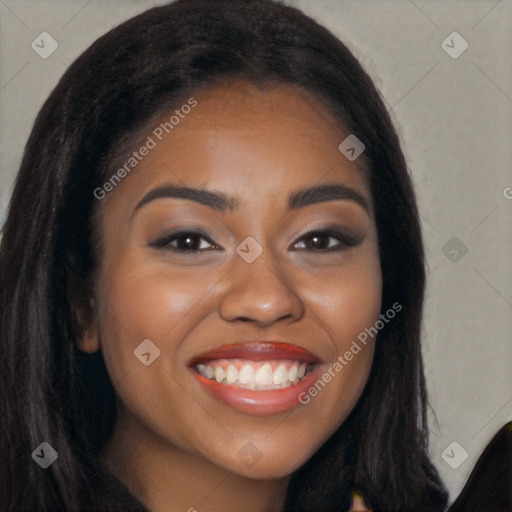 Joyful black young-adult female with long  brown hair and brown eyes