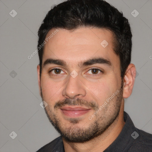 Joyful white young-adult male with short  black hair and brown eyes