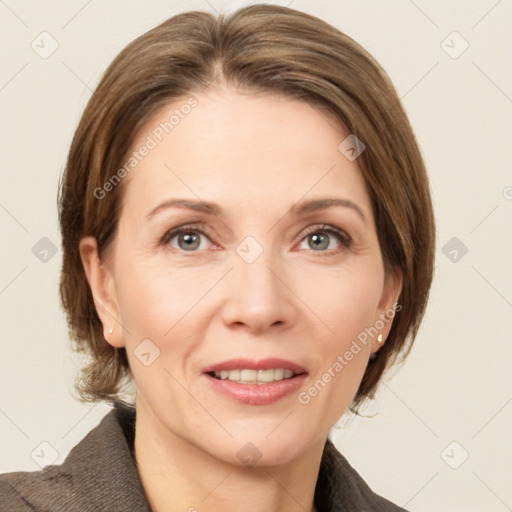 Joyful white adult female with medium  brown hair and grey eyes