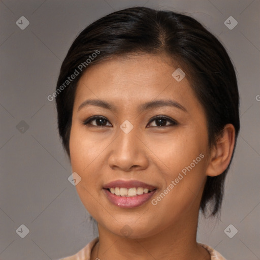 Joyful asian young-adult female with medium  brown hair and brown eyes