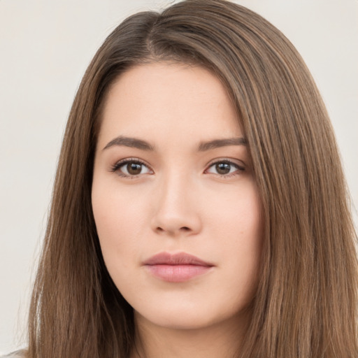 Neutral white young-adult female with long  brown hair and brown eyes