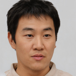 Neutral asian young-adult male with short  brown hair and brown eyes