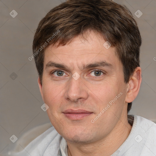 Joyful white adult male with short  brown hair and brown eyes