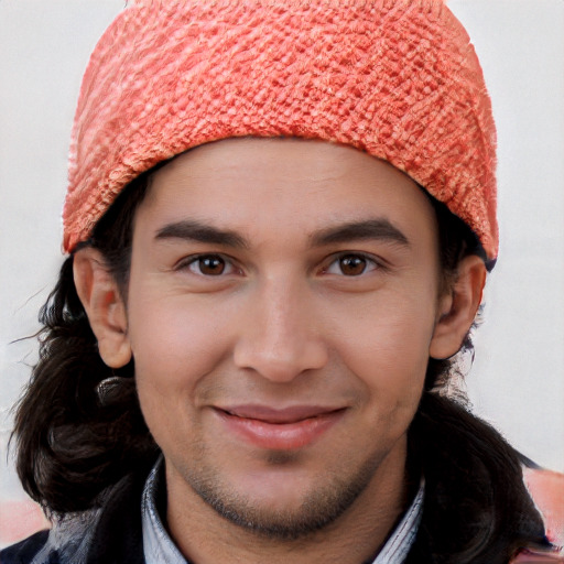 Joyful white young-adult male with long  brown hair and brown eyes