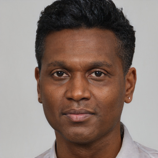 Neutral black young-adult male with short  black hair and brown eyes