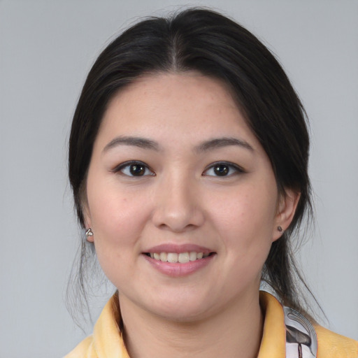 Joyful white young-adult female with medium  black hair and brown eyes