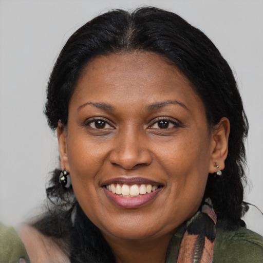 Joyful asian adult female with medium  brown hair and brown eyes