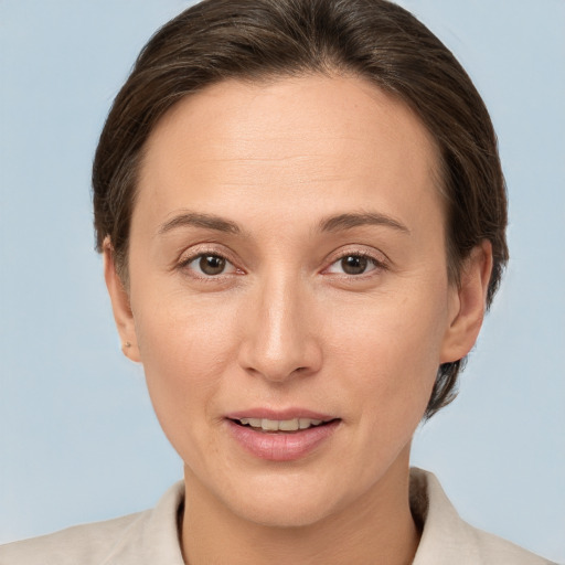 Joyful white adult female with short  brown hair and brown eyes