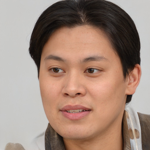 Joyful asian young-adult female with short  brown hair and brown eyes