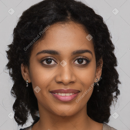 Joyful black young-adult female with long  brown hair and brown eyes