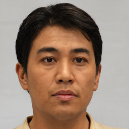 Neutral asian young-adult male with short  brown hair and brown eyes