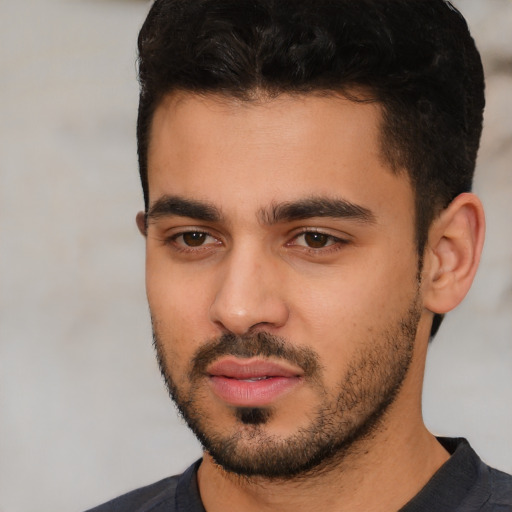 Neutral white young-adult male with short  black hair and brown eyes