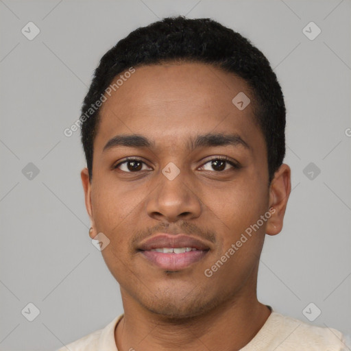 Joyful black young-adult male with short  black hair and brown eyes