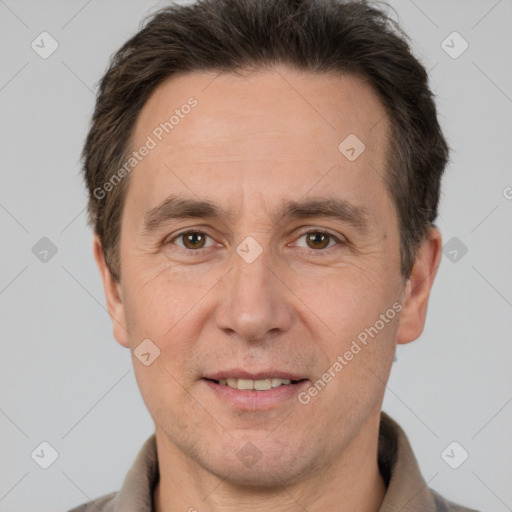 Joyful white adult male with short  brown hair and brown eyes