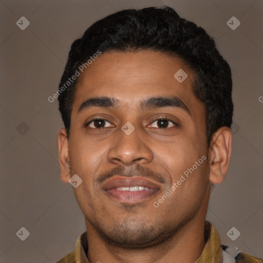 Joyful latino young-adult male with short  black hair and brown eyes