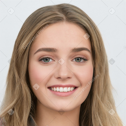 Joyful white young-adult female with long  brown hair and green eyes