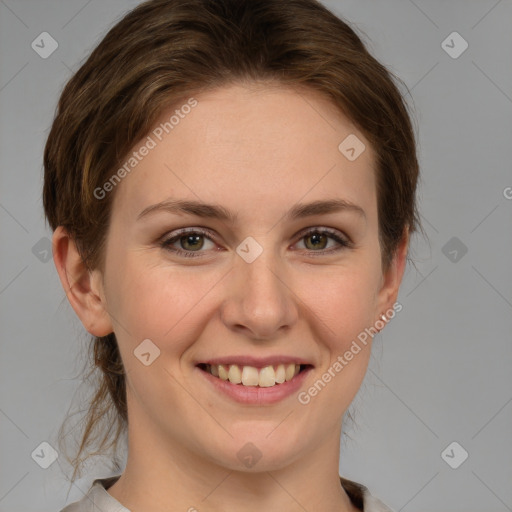 Joyful white young-adult female with medium  brown hair and green eyes