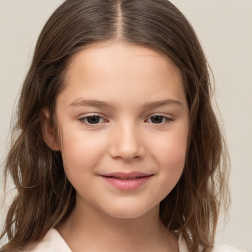 Joyful white child female with long  brown hair and brown eyes