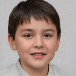 Joyful white child male with short  brown hair and brown eyes