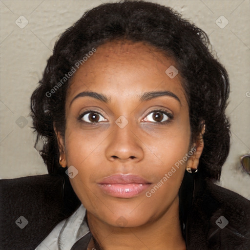 Joyful black young-adult female with long  black hair and brown eyes