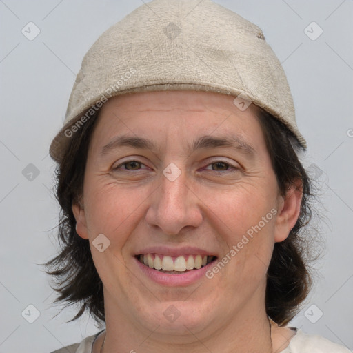 Joyful white adult female with medium  brown hair and grey eyes